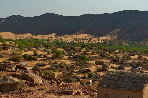 West Africa, Mauritania. View of the village of Guelta with houses of traditional architecture, located near an oasis in the middle of the stone desert in the south-west of the Sahara.