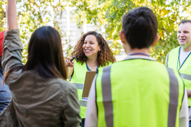 istock Unrecognizable woman volunteers answer when female coordinator asks question 2015438625