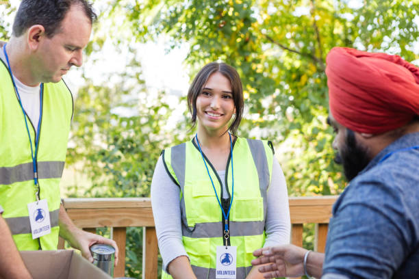 istock Young woman volunteering with dad smiles for camera 2015439141