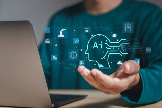 istock AI technology, Businessman use laptop and holding with AI tools for big data network connection by use artificial intelligence technology to help solve work problems. 2015455729