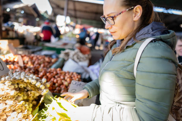istock Cheerful woman at the market 2015455736