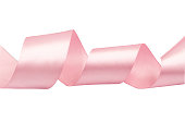Pink satin ribbol isolated on white. Closeup shiny material ribbon. Cutout material fabric strap.