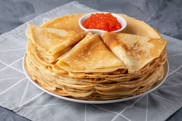 istock Pancakes with red caviar on grey background 2015466743