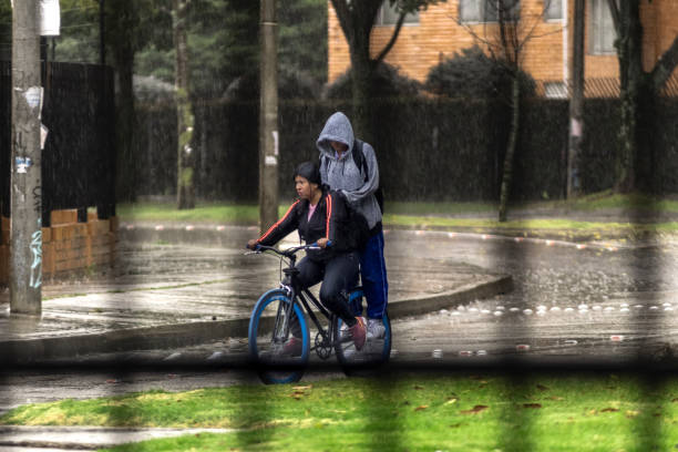 Motorbikes or motorcycle passing on the road during the rain
