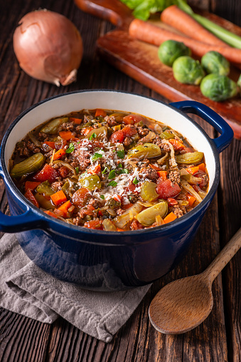 Cooking Italian Beef and Vegetable Stew in a Dutch Oven