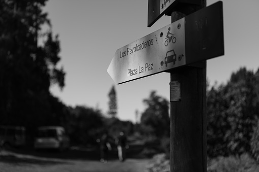 Black and white photo of a trail sign in Tenerife, Spain