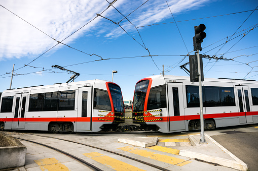 The Metro train on the street on a bright sunny day with blue sky in San Francisco, California.   An efficient and convenient method of public transportation.