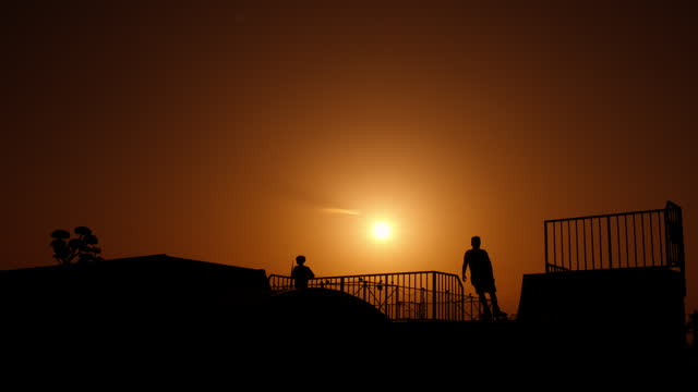 Teen silhouette during sports activities.