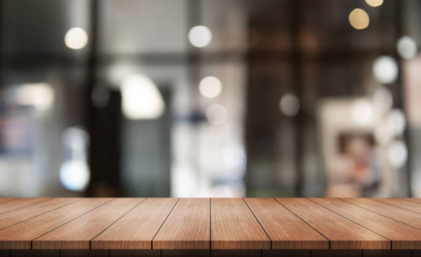 istock Empty wooden table top with lights bokeh on blur restaurant background. 2015617881