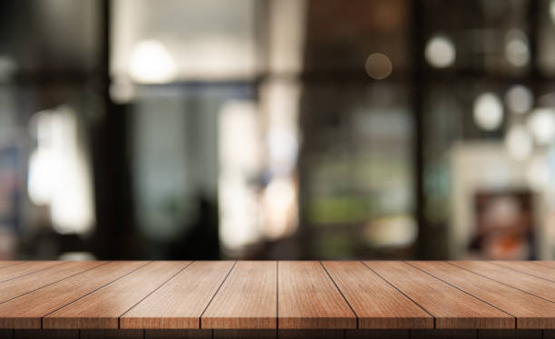 istock Empty wooden table top with lights bokeh on blur restaurant background. 2015617891