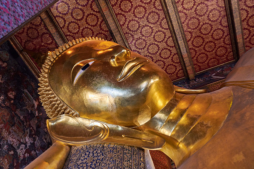 The famous Reclining Buddha at Wat Pho temple. Phra Nakhon District. Bangkok. Thailand.
