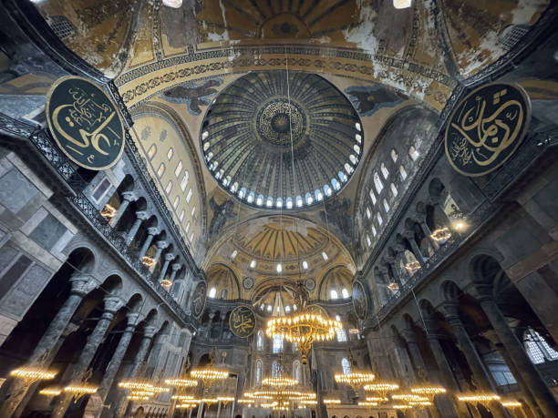 istock Hagia Sophia, Istanbul landmark old ancient mosque dome with candles inside view 2015651996