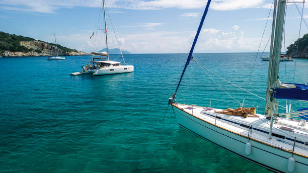 istock Two young women enjoying vacation on sailboat 2015652013