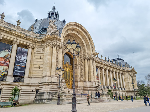 Paris, France - 5 March, 2023: People walking by the Petit Palais. It is one of fourteen museums of the City of Paris