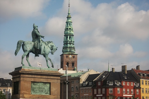 Equestrian statue of Frederik VII in front of Christiansborg palace at Copenhagen, Denmark. Sculpture of King Frederick VII by Wilhelm Bissen on Slotsholmen. Copenhagen, Denmark - August 20, 2008