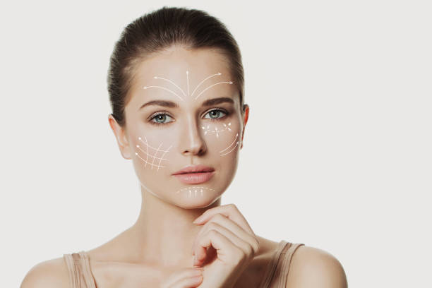 istock Graphic lines shows face lifting effect on young female face 2015684364