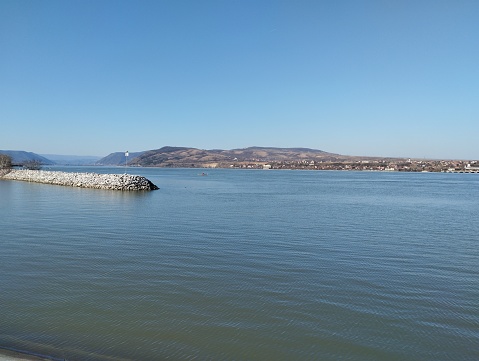 The small stone port on Danube with hills in background