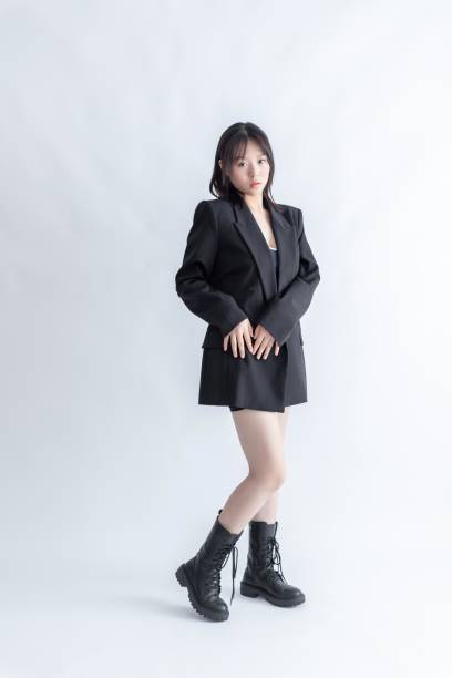 istock Asian woman in black suit and boots 2015749608