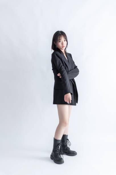 istock Asian woman in black suit and boots 2015750122