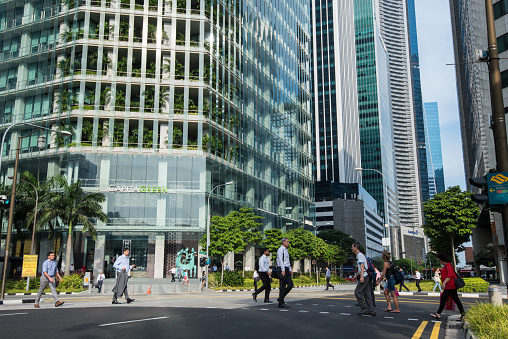 Singapore City, Singapore - September 08, 2023: At the end of the working day, office workers on the streets of the Central Business District.