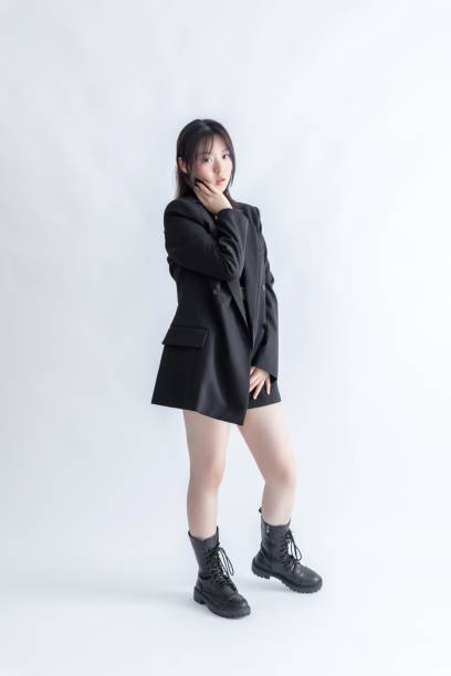 istock Asian woman in black suit and boots 2015761050