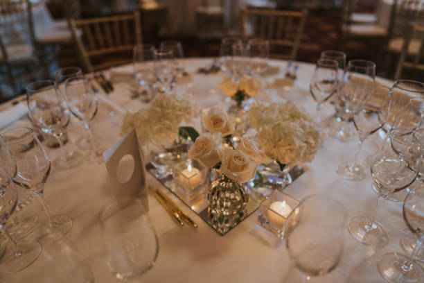 istock Floral centerpiece in white tones. Sunset, illuminated by candlelight. 2015769922