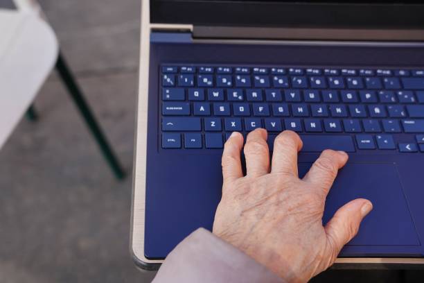 istock an unrecognizable old woman working with laptop outside 2015802051