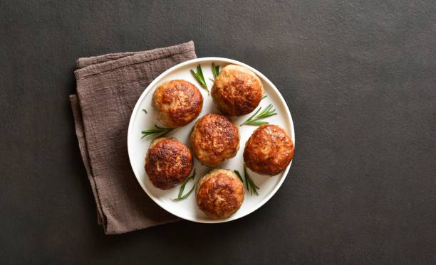 istock Homemade cutlets from minced meat on plate over dark background 2015811335