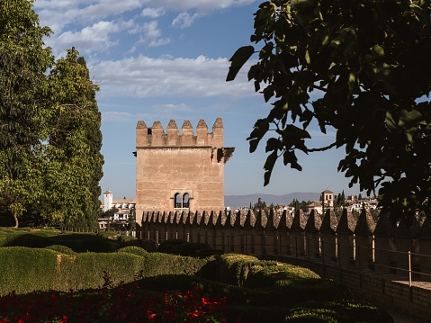 The Alhambra Overlooks The City Of Granada, Spain In Andalusia With The Sierra Nevada Mountains In The Background.