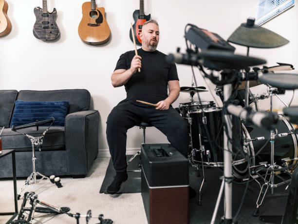istock Male music teacher at drumming music studio 2015862800