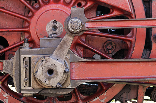 Details of the wheel mechanism of an old steam locomotive.