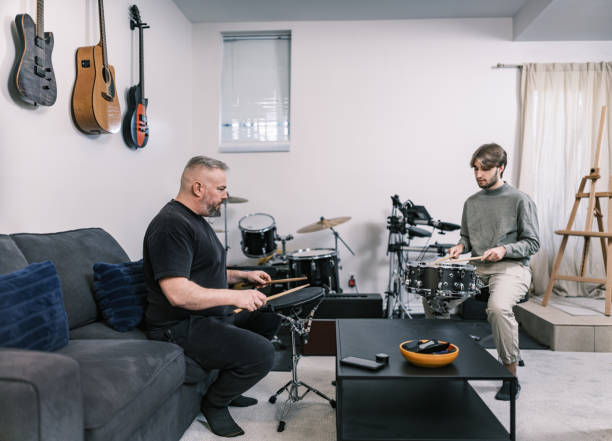 istock Male music teacher at drumming music studio 2015864769