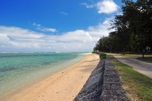 Rivière Des Galets, Savanne District, Mauritius: Saint Felix public beach - south coast - emerald waters and immaculate white sand beach on the coastal road - gabions installed along the beach as protection against coastal erosion and rising sea levels.