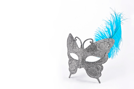 butterfly mask with silver diamond and blue feather, isolated on white background with space for text