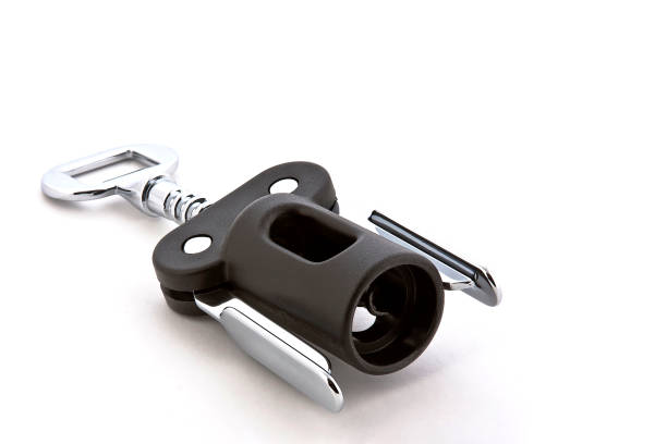 Black and metallic corkscrew on white background with space for text Black and metallic corkscrew on white background with space for text, minimal concept, wine bottle opener, cork tornillo stock pictures, royalty-free photos & images
