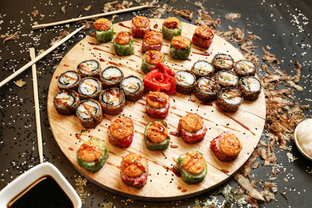 Assorted Sushi Rolls on Wooden Plate