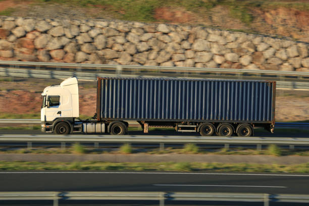 istock Articulated truck transporting a maritime container 2015936381