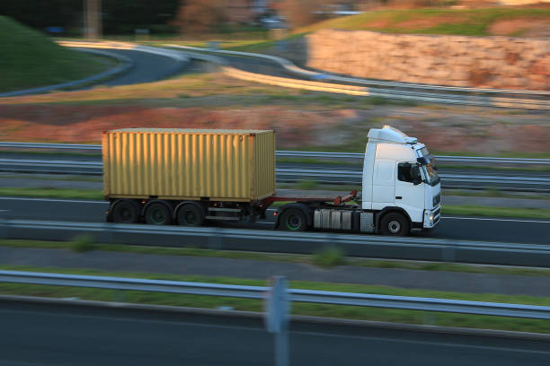 istock Articulated truck transporting a maritime container 2015939961