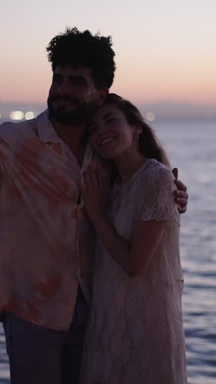 Couple takes a flash photo in the sea in Valencia