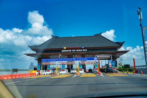 Bali, Indonesia - August 29, 2023: Gerbang Tol Nusa Dua payment gate in the southern part of the island.