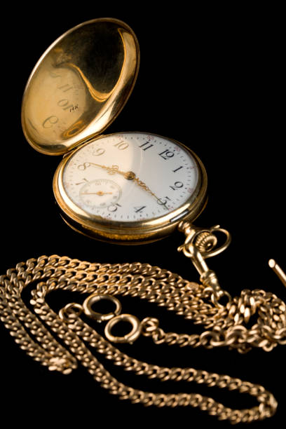 istock Antique 14 karat gold pocket watch with carrying chain 2016010219