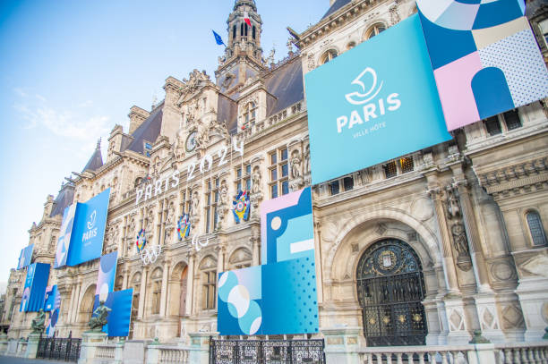 Advertisement for Paris 2024 February- 1- 2024- Paris France-Paris architecture is already decorated with ads about the Olympics construction slogans pictures stock pictures, royalty-free photos & images