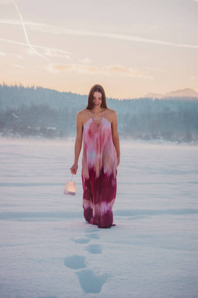 istock Young woman explores winter landscape with lantern 2016122375