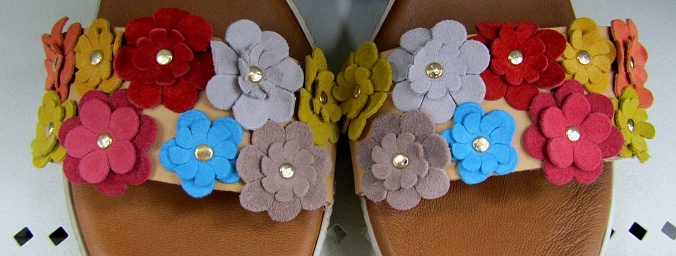 Close up of women shoes decorated with beautiful suede flowers