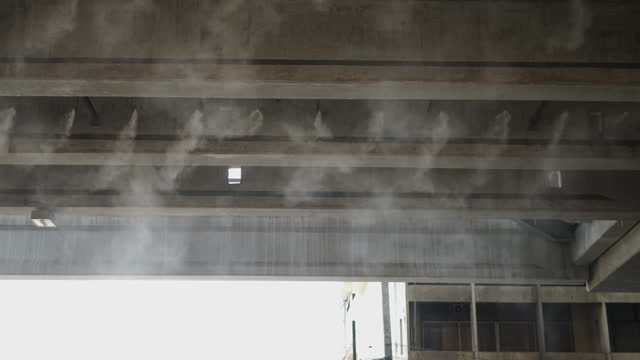 In a building of Thailand some steam is coming out