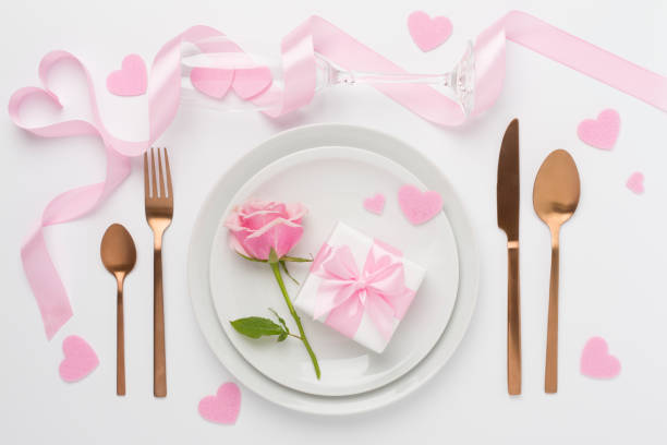 istock Festive table setting for Valentine's Day on color background, top view 2016266993