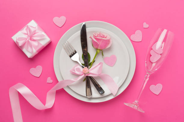 istock Festive table setting for Valentine's Day on color background, top view 2016267004