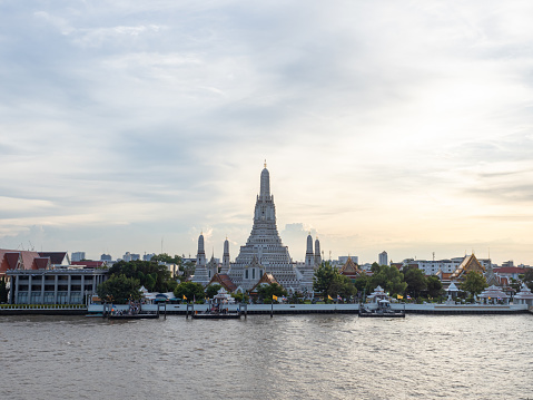 The ancient famous temple, Wat Arun Ratchawararam, during the day time, Bangkok, Thailand.