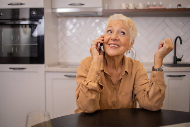 istock Happy senior woman using smartphone 2016367977
