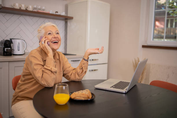 istock Happy senior woman using laptop 2016368532